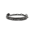 Silver cuff bracelet with texture and chain on a white background made in Berlin