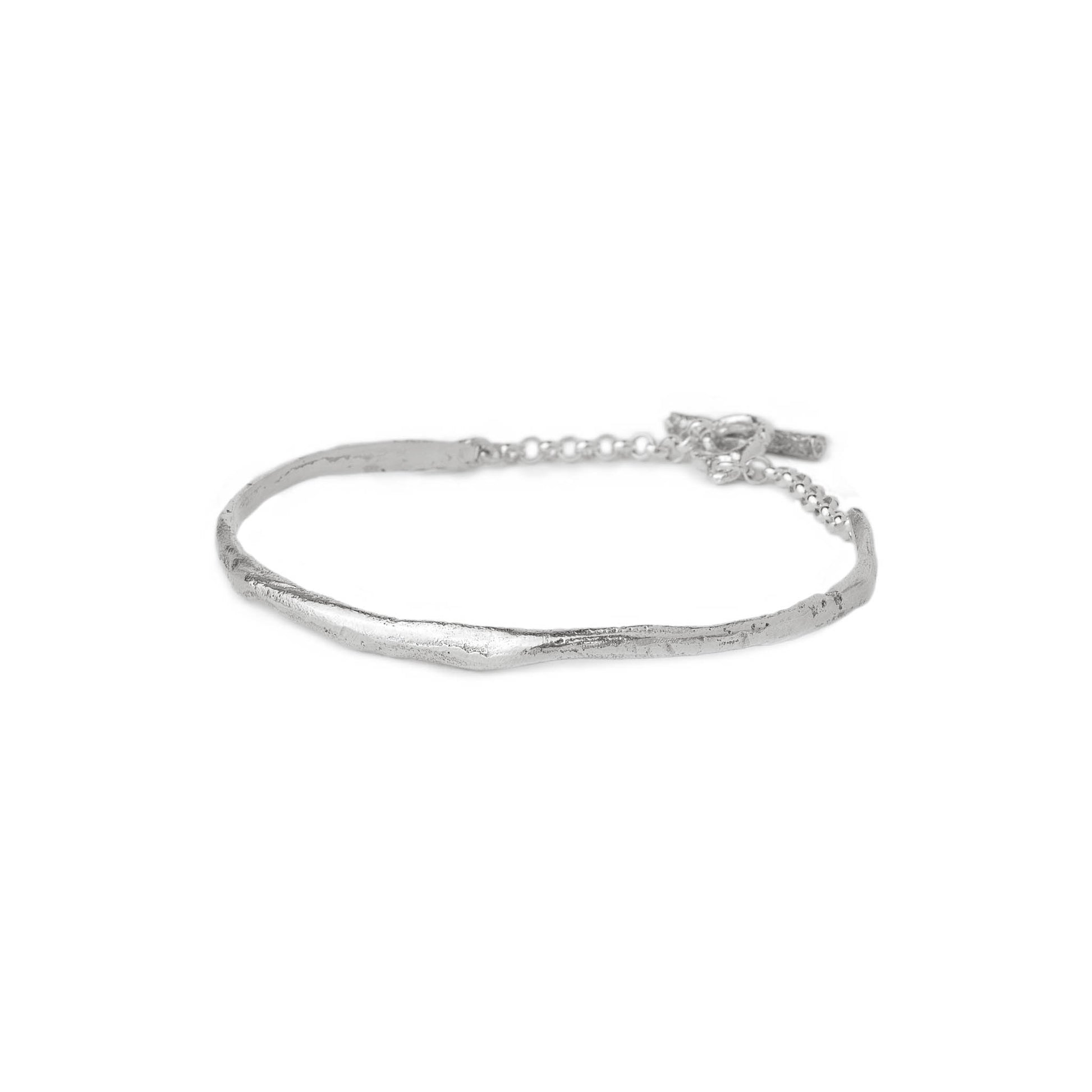 Silver cuff bracelet on a white background