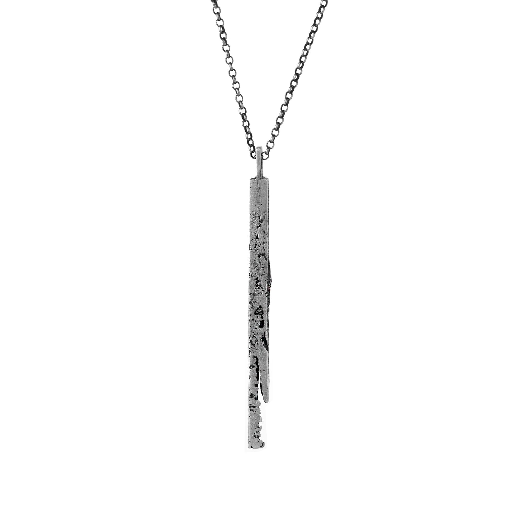 Handcrafted sterling silver bar pendant with a subtle vertical fissure suspended from a sterling silver chain.