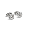  Handcrafted sterling silver disc stud earrings set with brilliant cut moissanites and a natural cast finish.