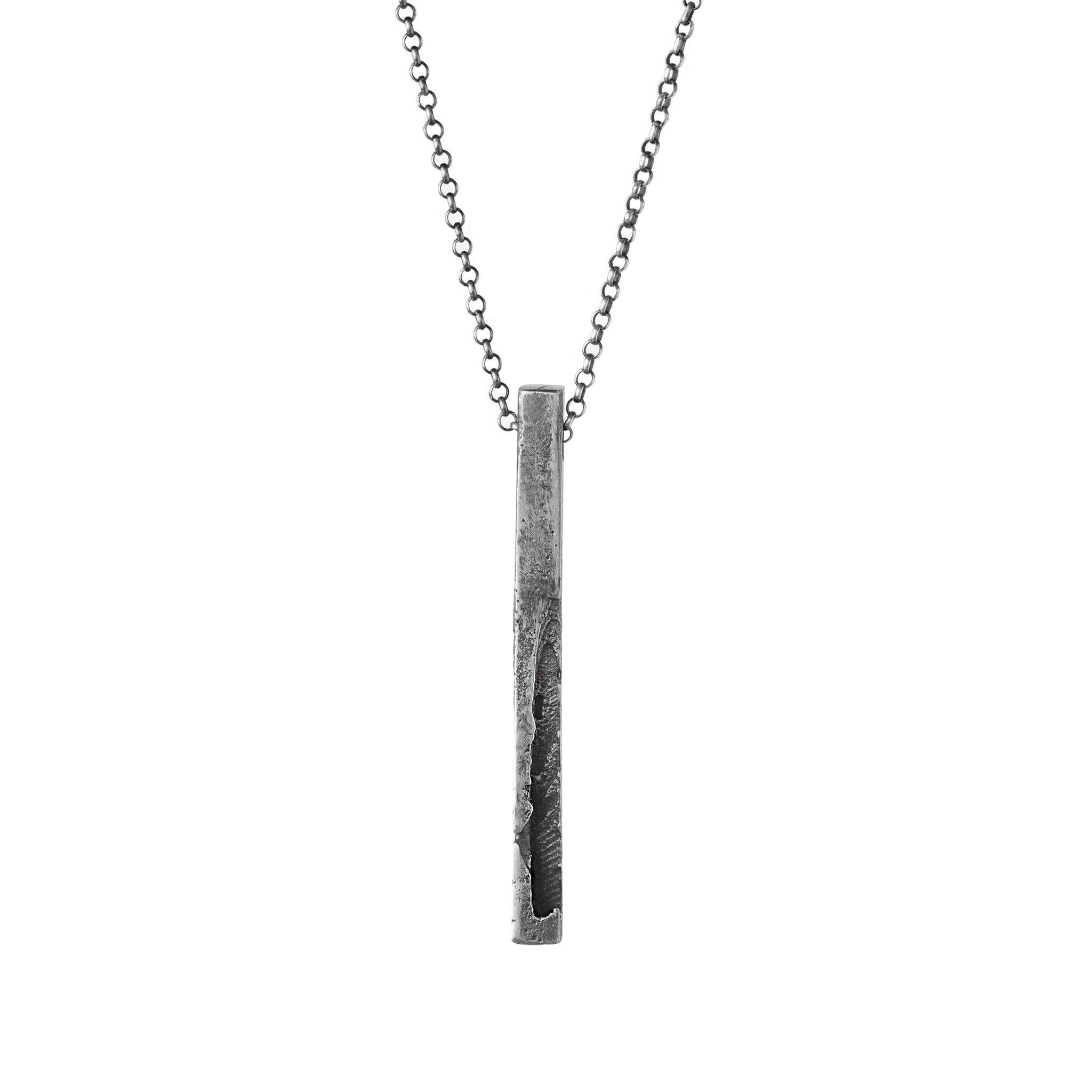 Handcrafted sterling silver monolith pendant necklace with a sculptural textured bar pendant