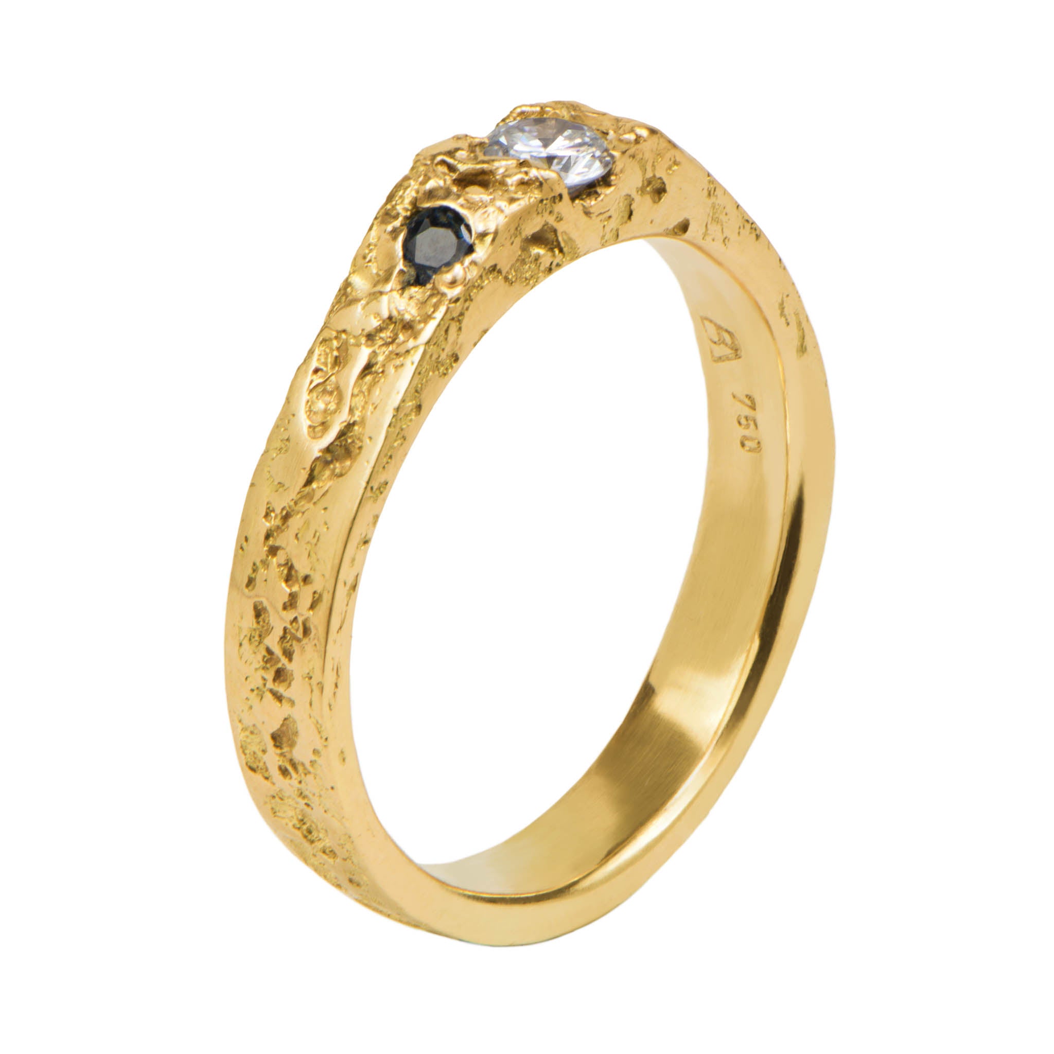 Gold ring with embedded gemstones on a white background
