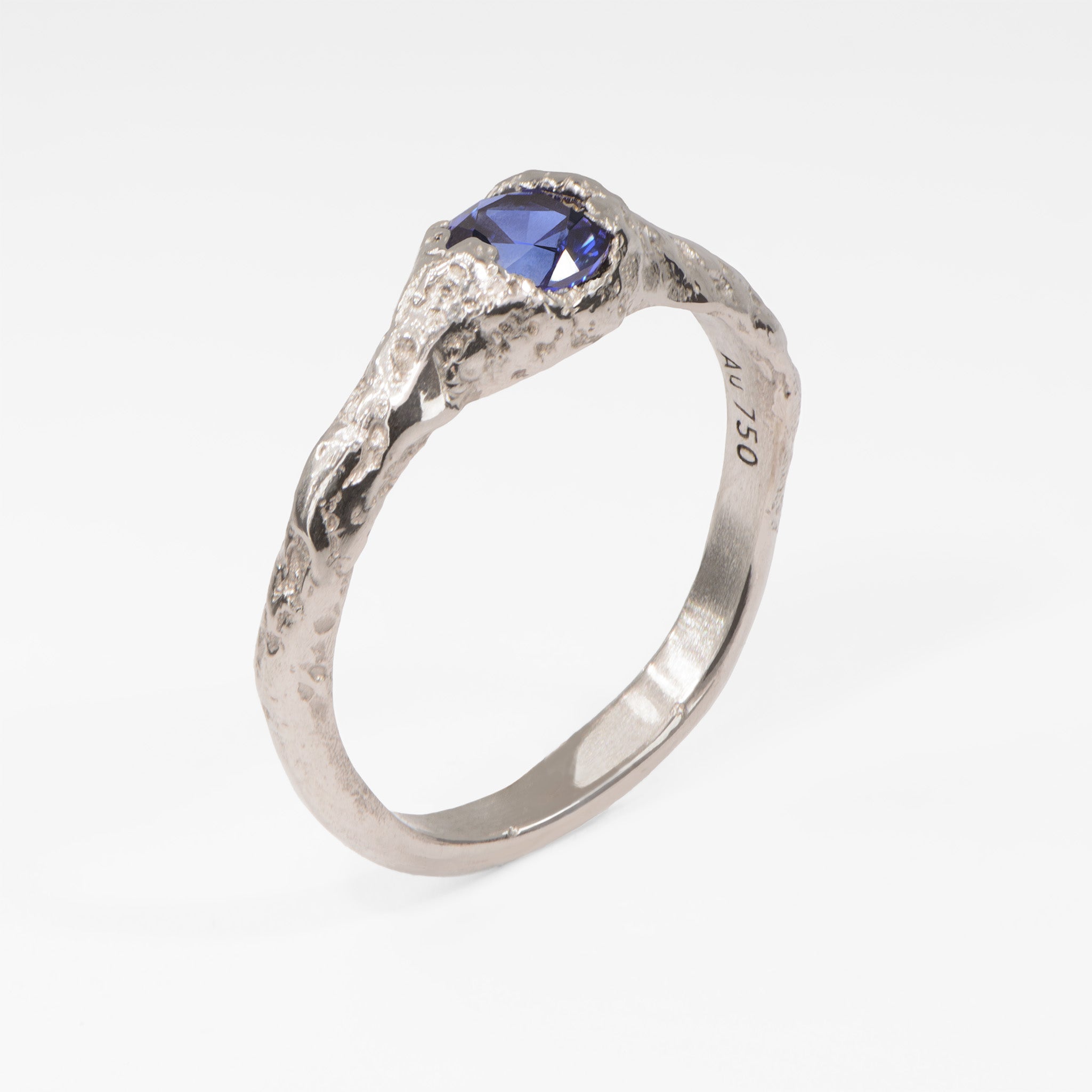 Organic white gold sapphire ring featuring a brilliant blue sapphire, contemporary alternative engagement ring with natural sculptural design