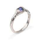 Blue sapphire set in an organic handcrafted white gold engagement ring