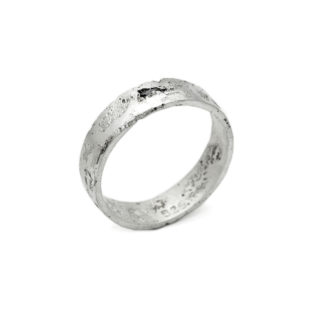 Kaewkosin ring in sterling silver with a black moissanite, artisan handcrafted jewelry featuring an organic textured surface and polshid interior