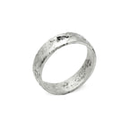 Kaewkosin ring in sterling silver with a black moissanite, artisan handcrafted jewelry featuring an organic textured surface and polshid interior