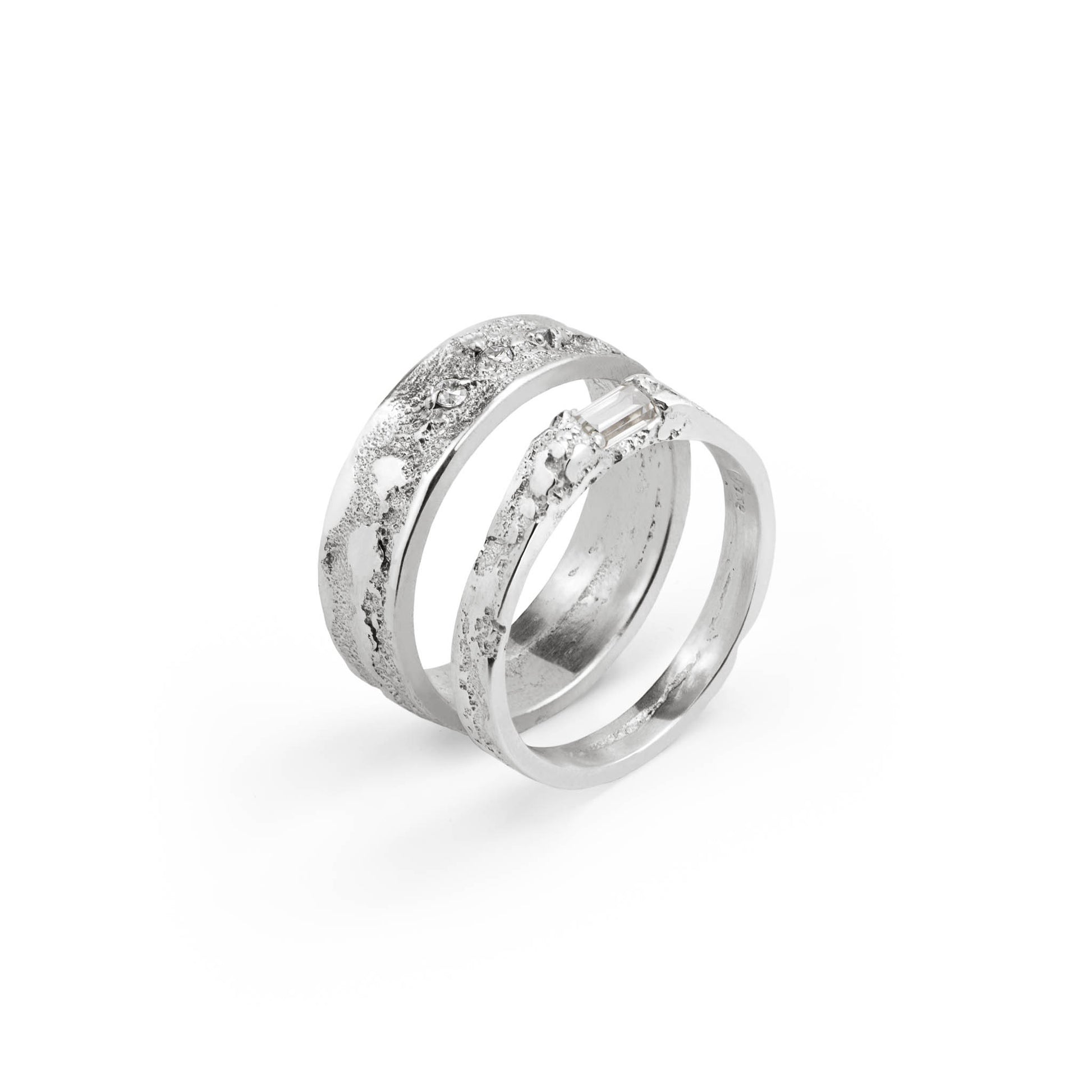 Wedding rings with moissanite diamonds on a white background