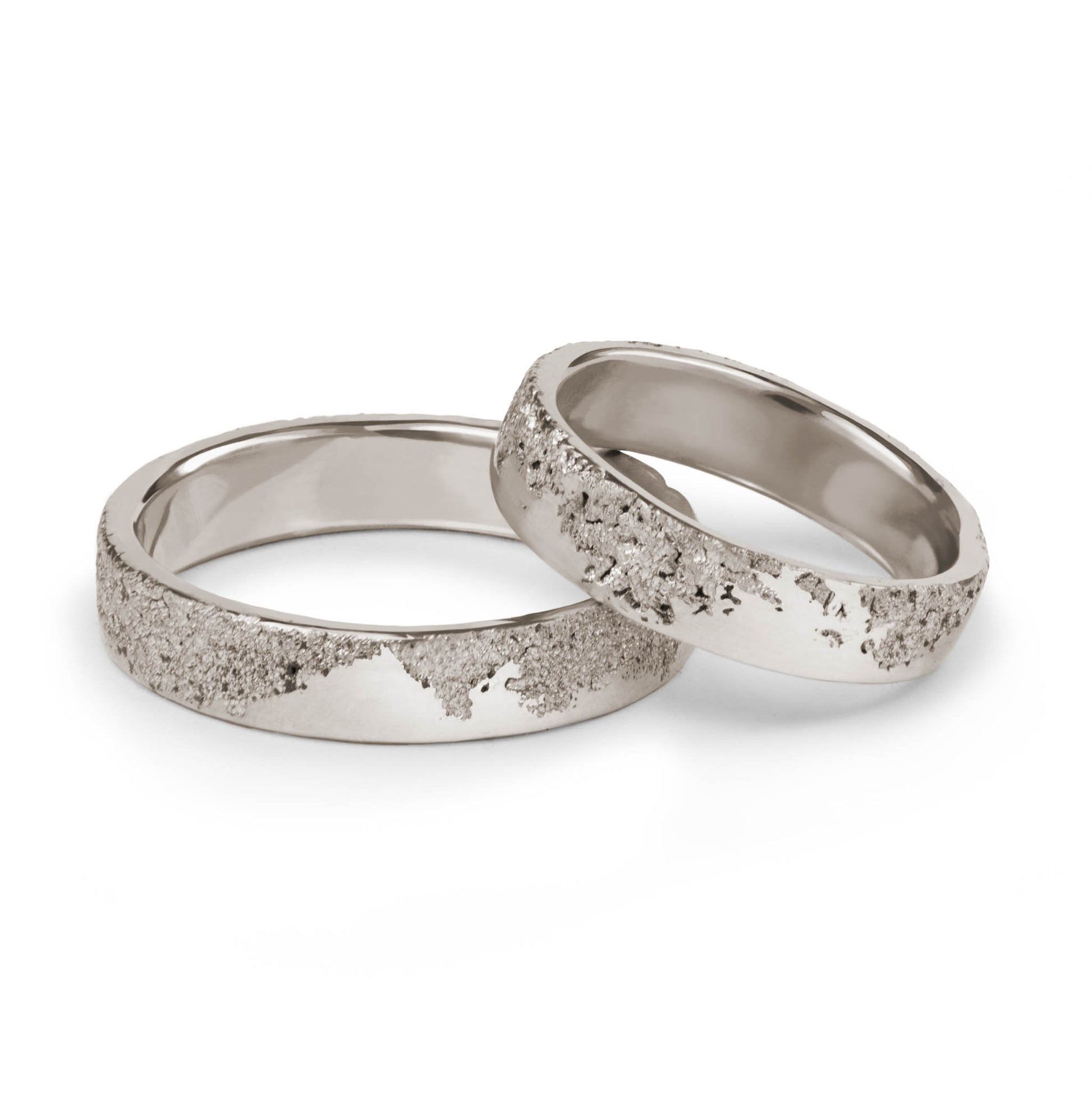 Wedding Bands in white gold with a sand like texture handcrafted in Berlin.
