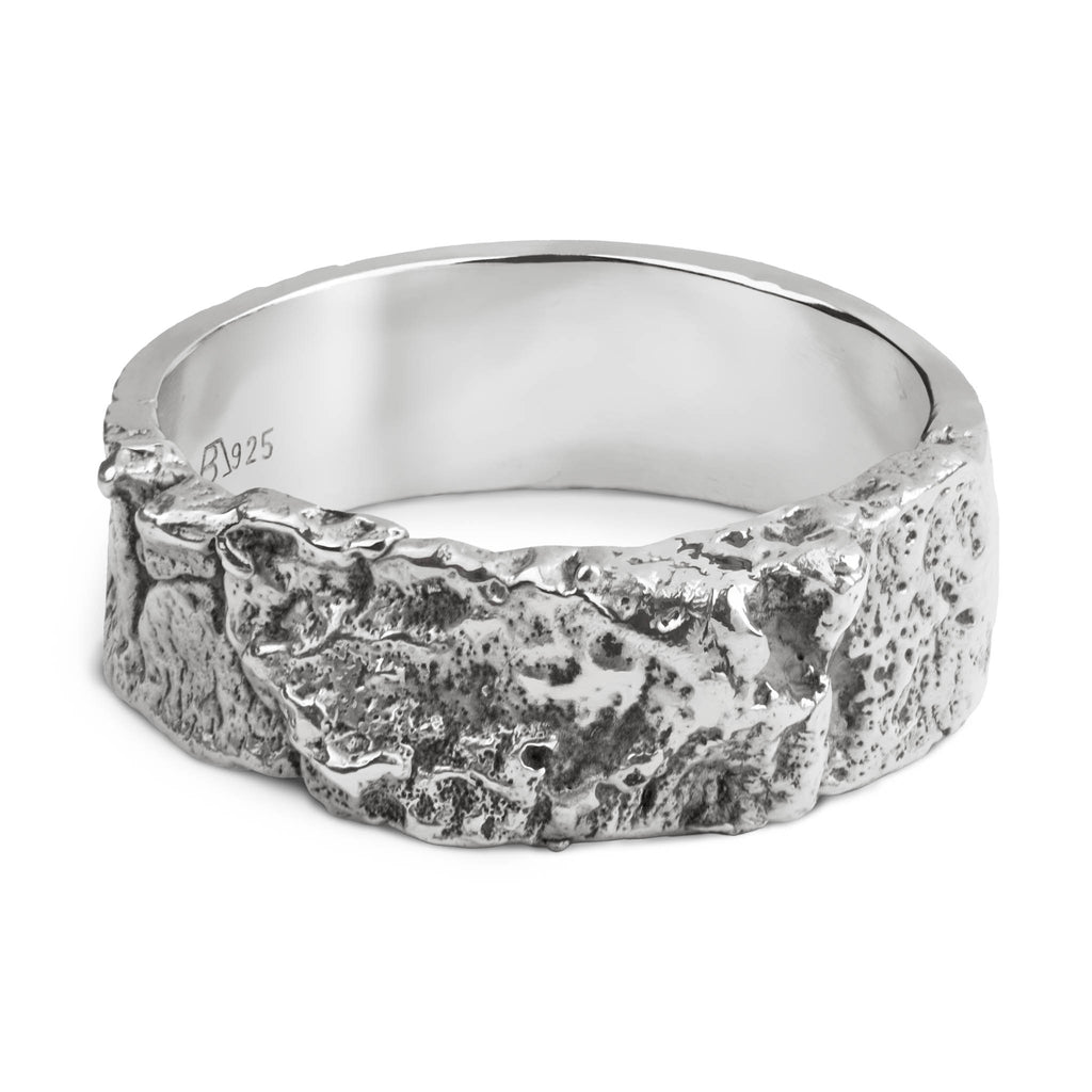 Handcrafted sterling silver ring with a polished interior and a tree bark textured 6mm wide organic band.
