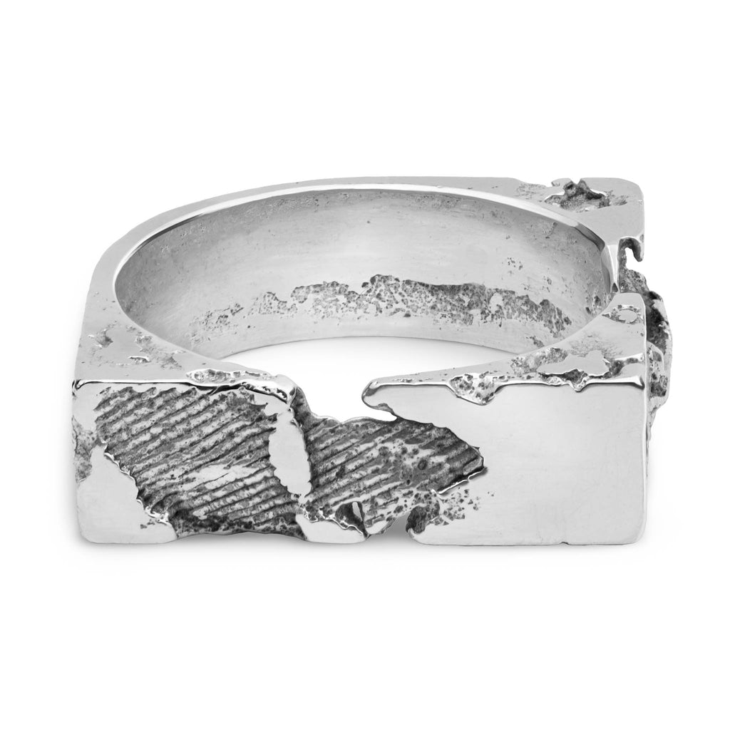 Handcrafted sterling silver ring with sculpted 8 mm wide band featuring textured and polished contrasts.