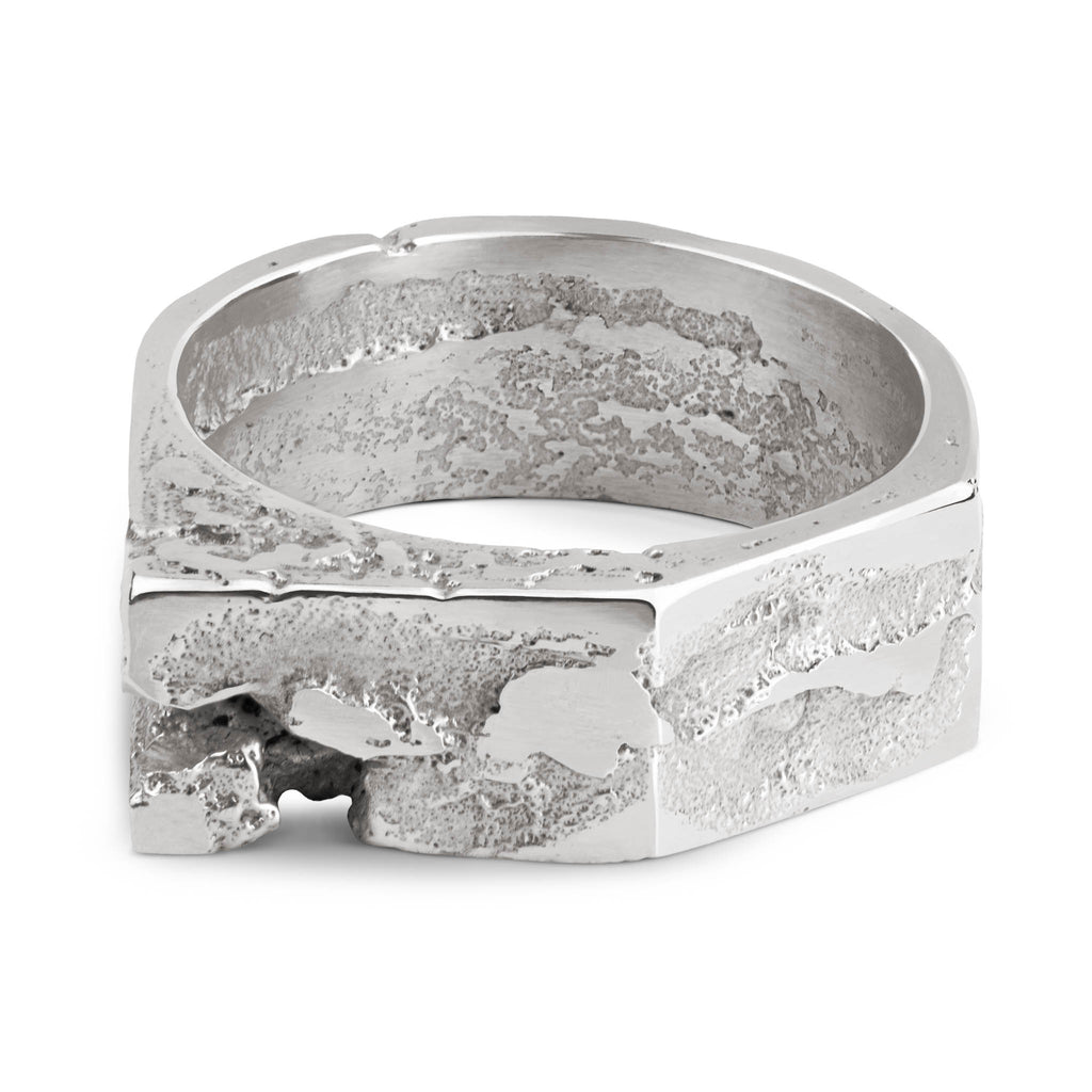 Geometric sterling silver ring with a brutalist design and a raw texture, handcrafted in our Berlin jewelry studio.