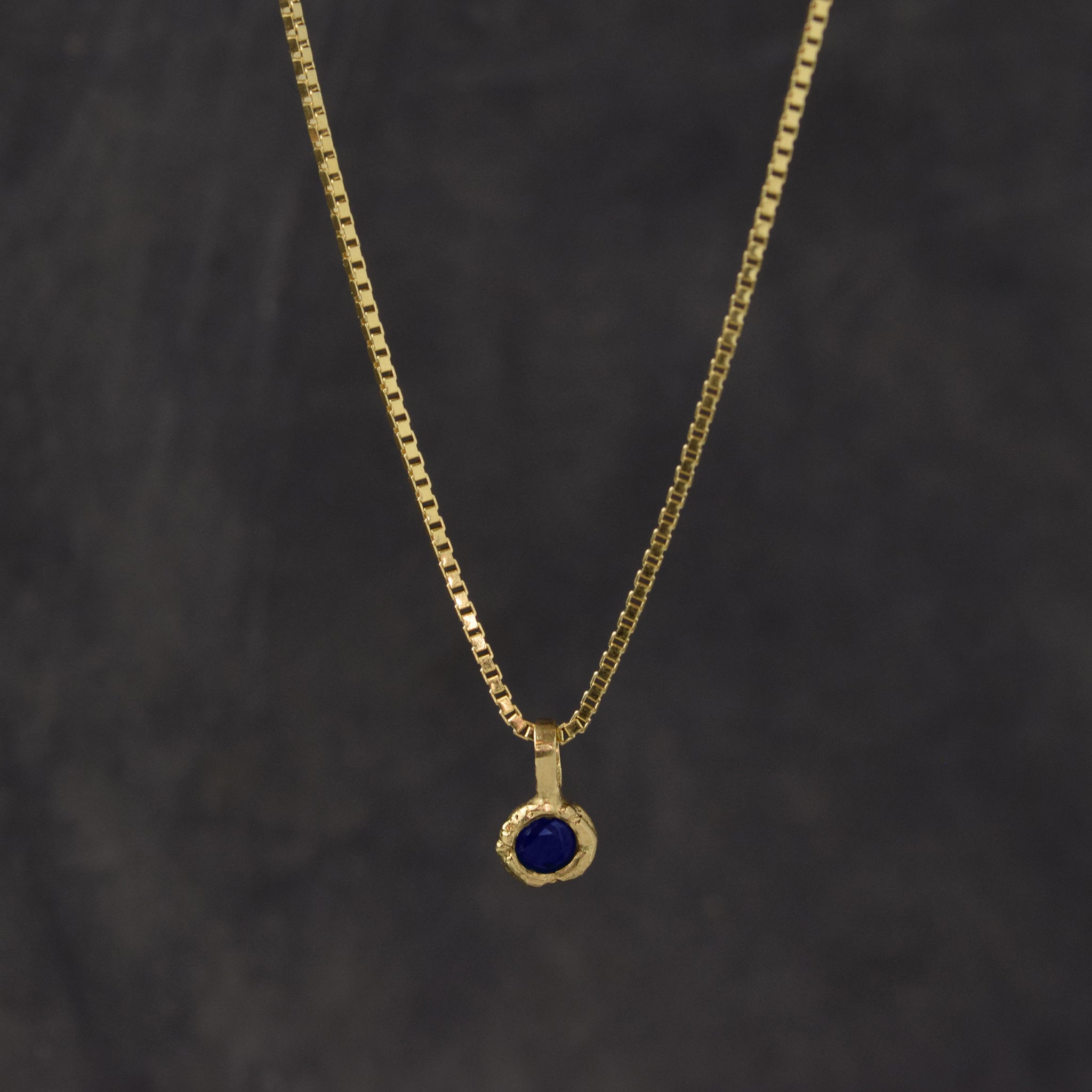 Gold Charm Necklace With Blue Sapphire