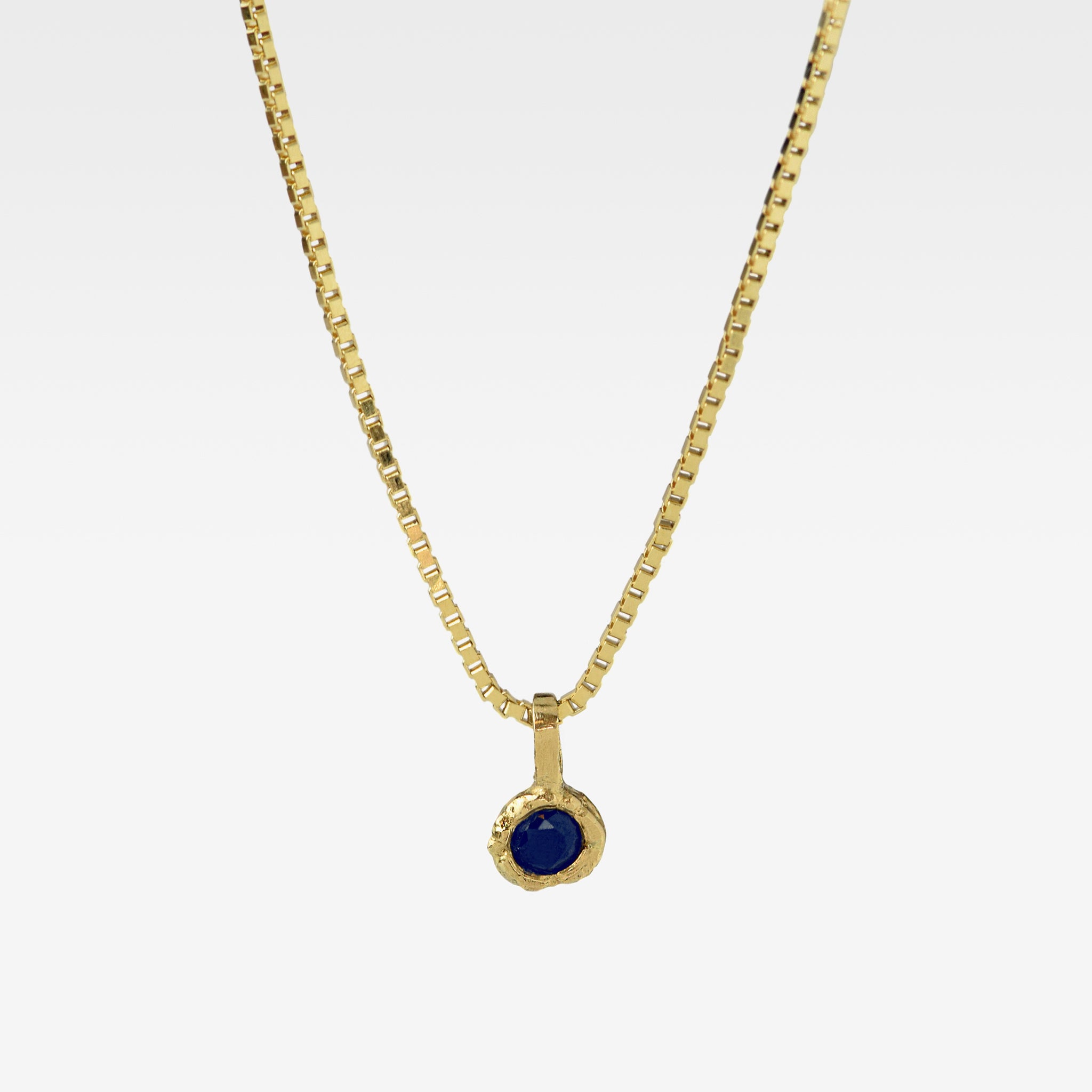 Gold Charm Necklace With Blue Sapphire