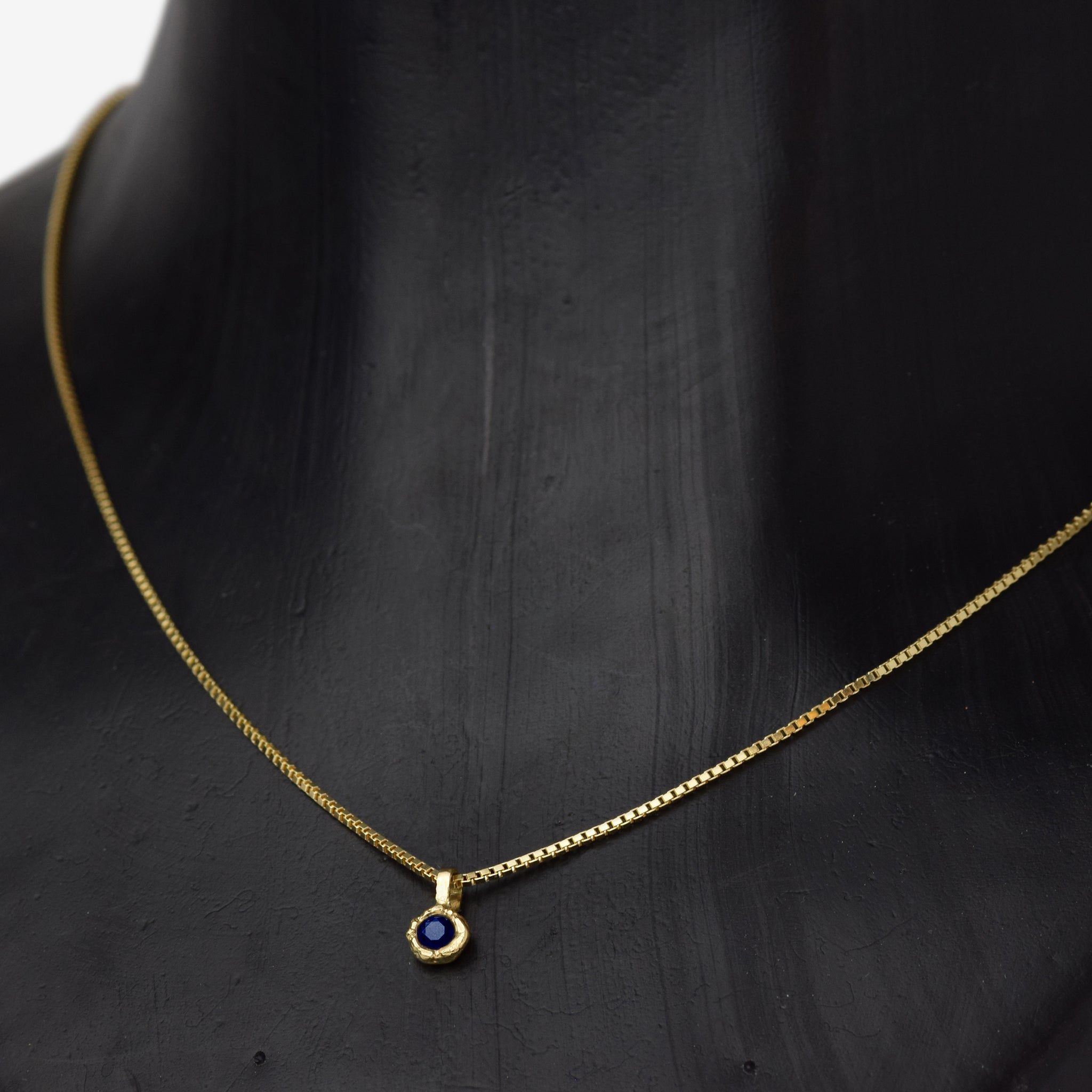 Gold Charm Necklace With Blue Sapphire