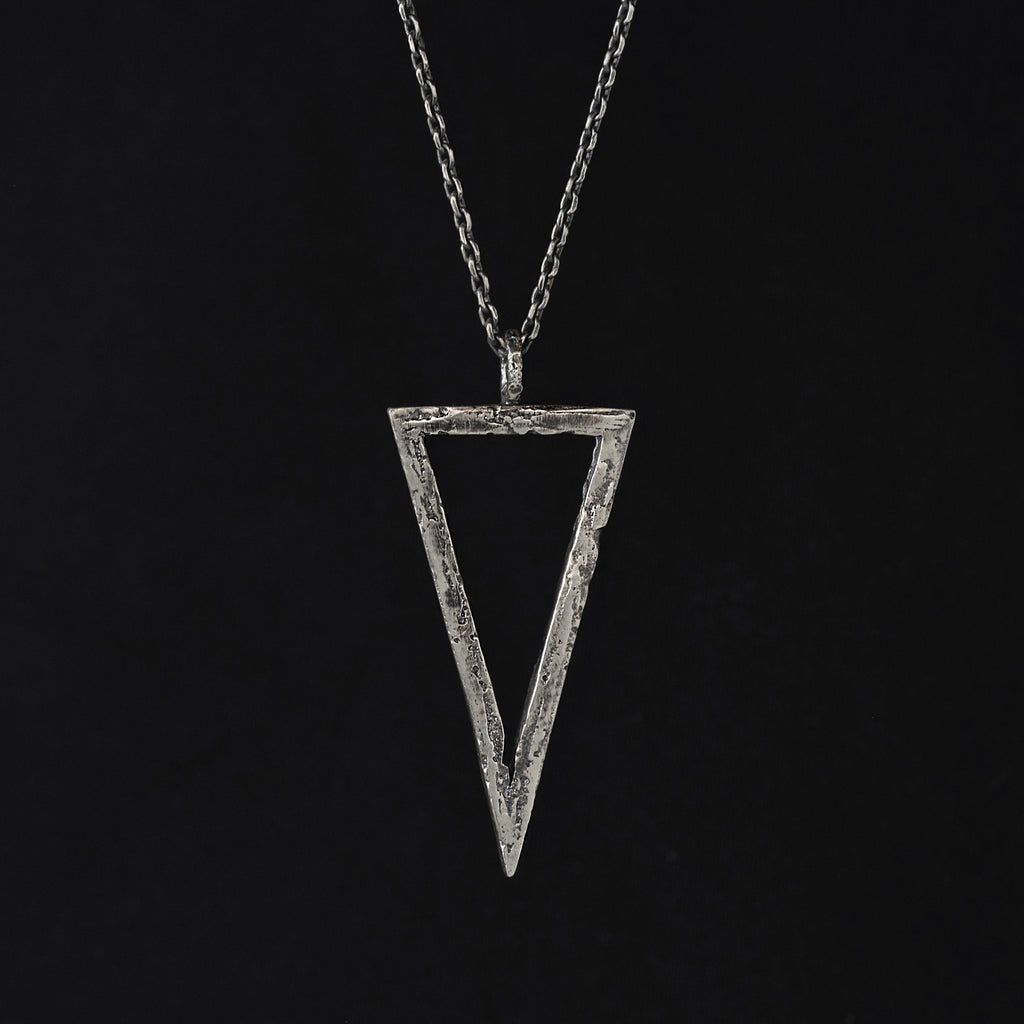 Handcrafted sterling silver triangle pendant necklace with an organic textured geometric design