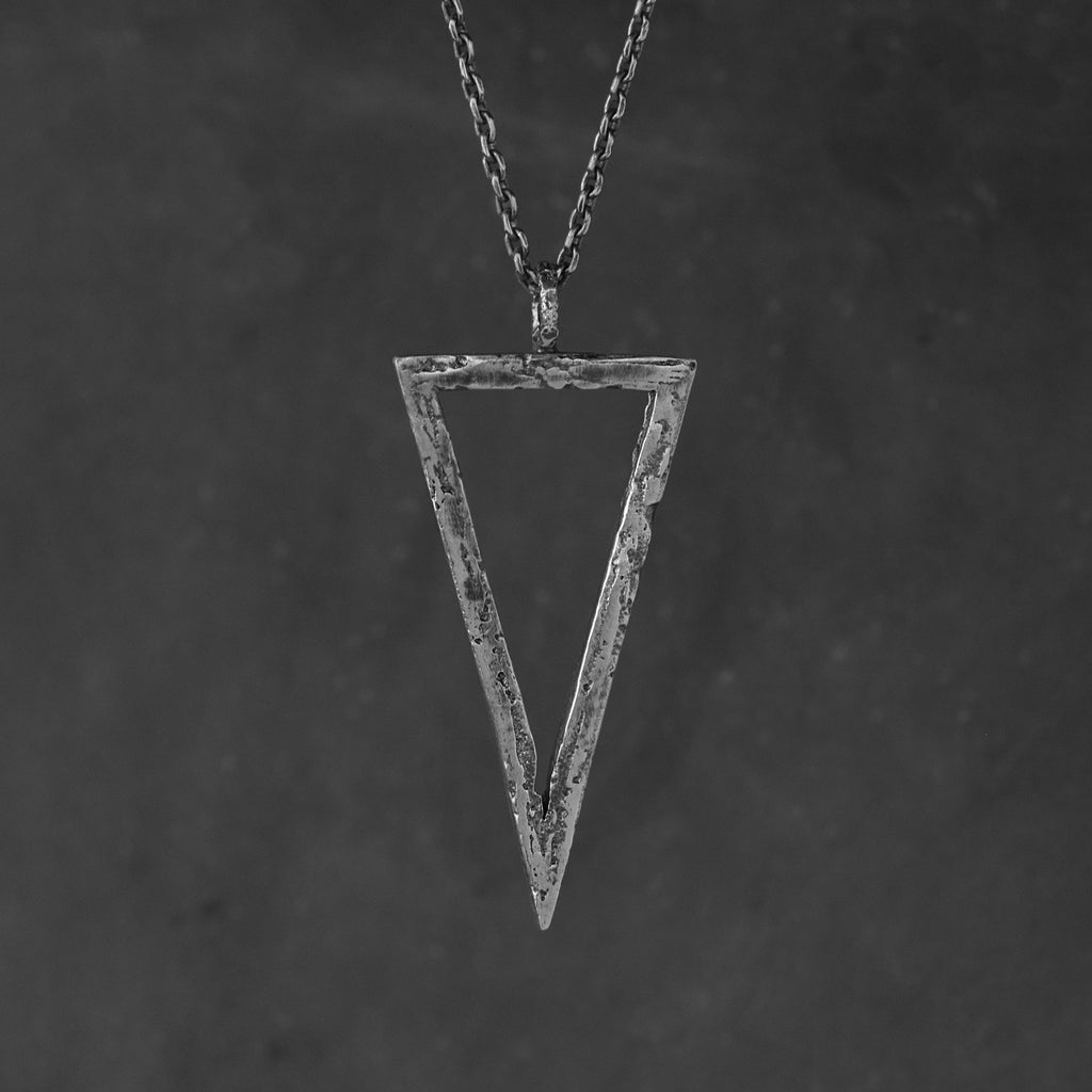Handcrafted sterling silver triangle pendant necklace with an organic textured geometric design