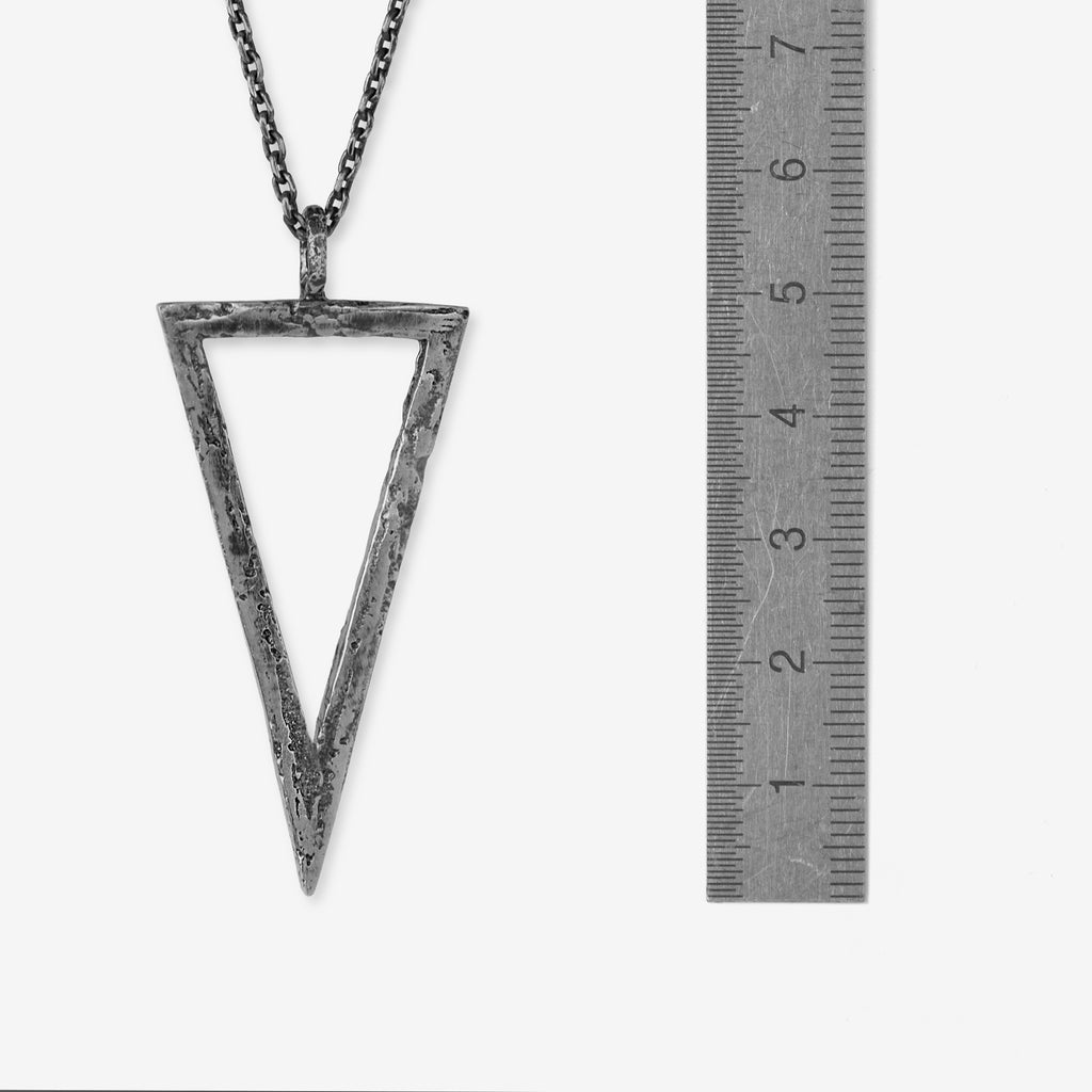 Handcrafted sterling silver triangle pendant necklace with an organic textured geometric design